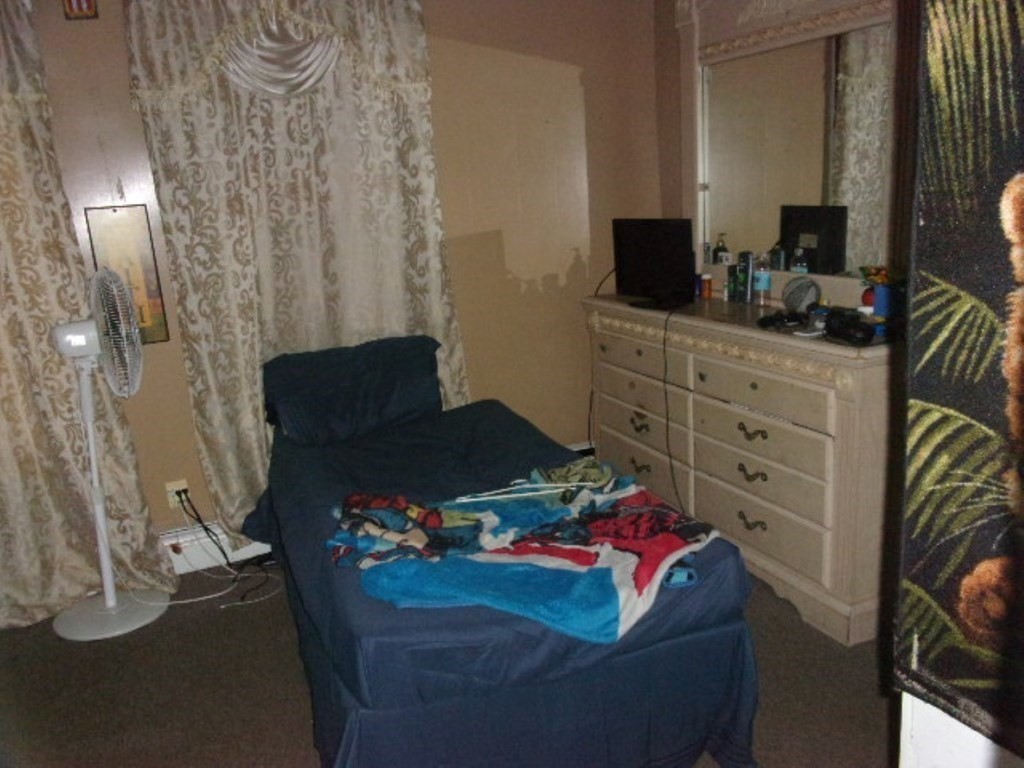 18-20 Conduit Street Lawrence, MA 01841 - Photo 18 of 23 a bedroom with a bed and furniture