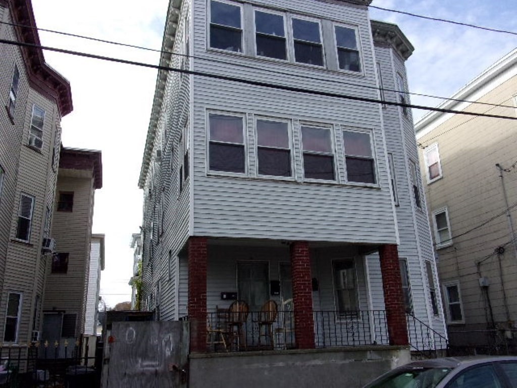 18-20 Conduit Street Lawrence, MA 01841 - Photo 3 of 23 a view of a house with a street
