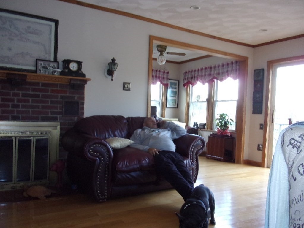 18-20 Conduit Street Lawrence, MA 01841 - Photo 7 of 23 a living room with furniture and a fireplace