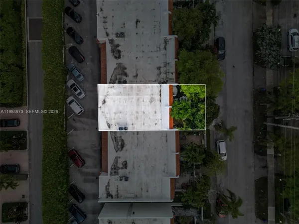 an aerial view of multiple houses with yard