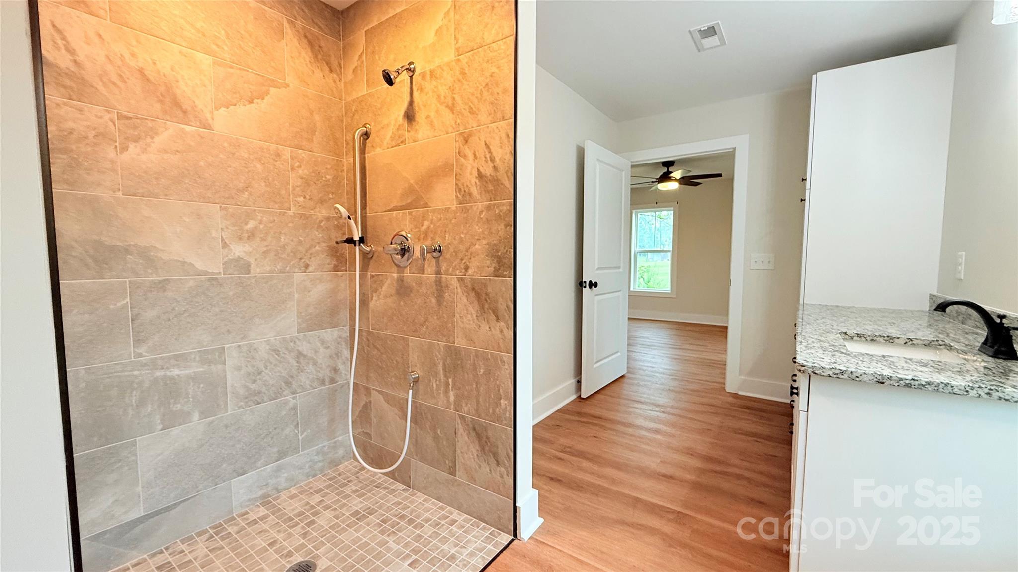 203 Beacon Avenue Morganton, NC 28655 - Photo 13 of 18 a bathroom with a granite countertop shower