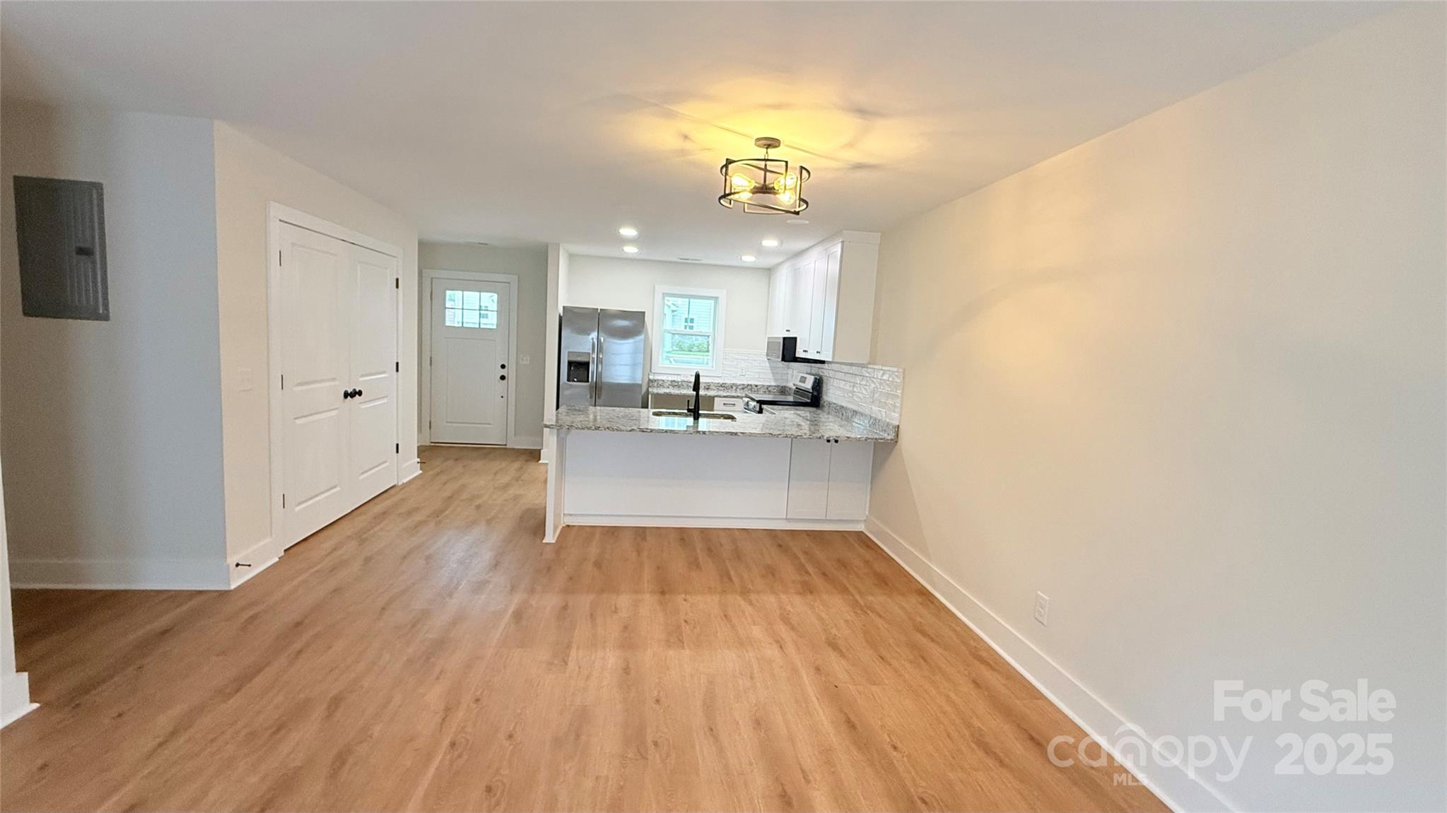 203 Beacon Avenue Morganton, NC 28655 - Photo 7 of 18 a view of a kitchen from the hallway