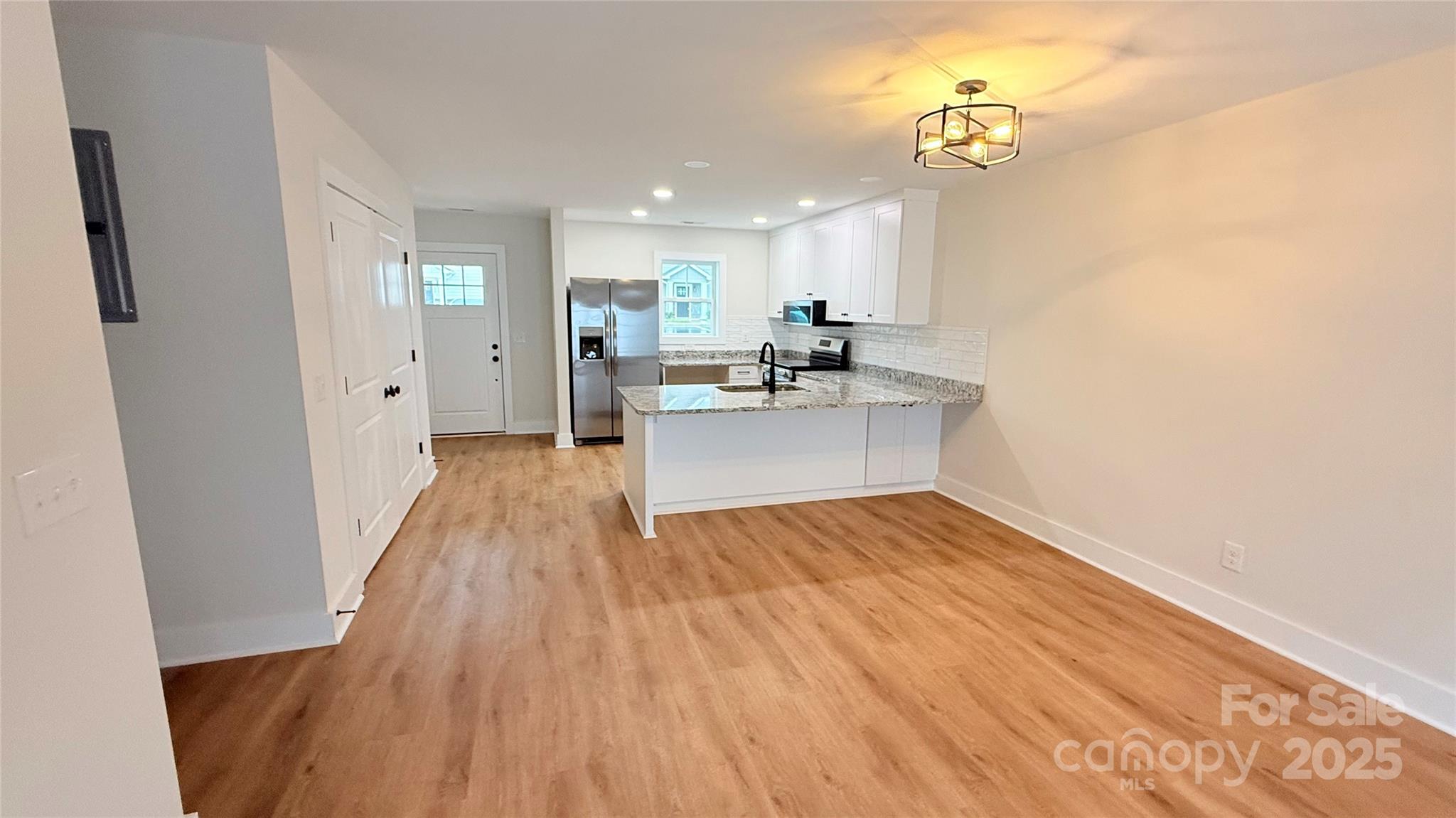 203 Beacon Avenue Morganton, NC 28655 - Photo 8 of 18 a view of kitchen with sink and wooden floor