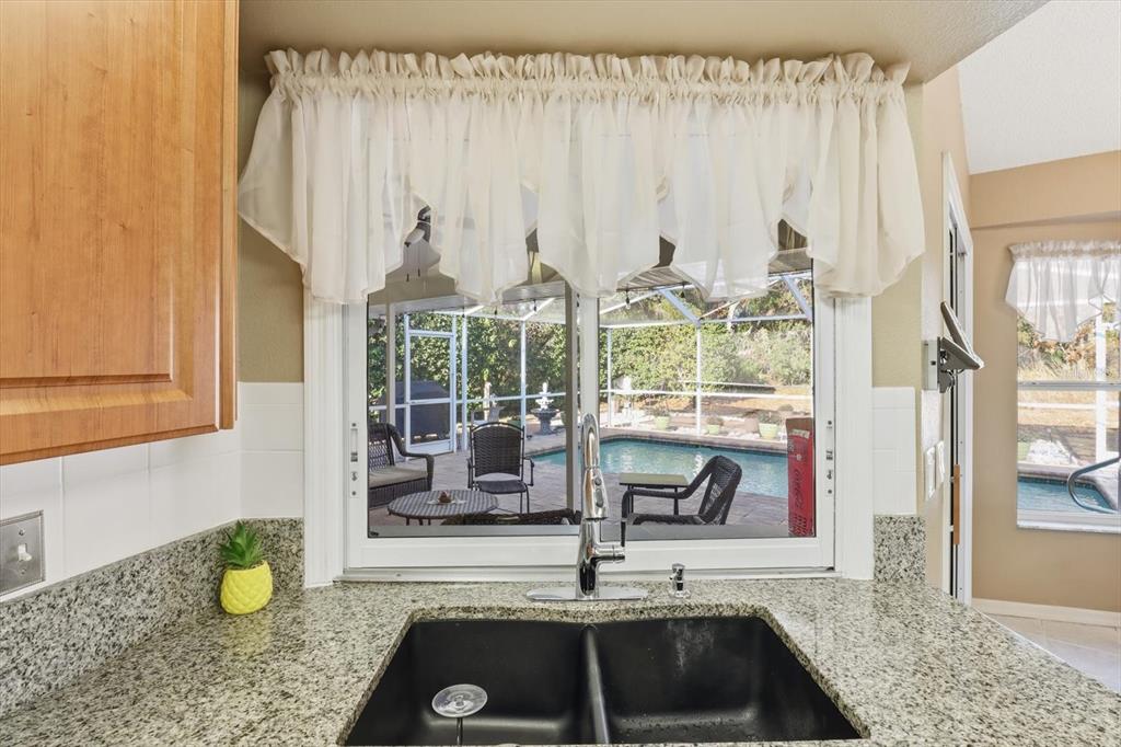3 Ipomoea Court Homosassa, FL 34446 - Photo 14 of 46 a kitchen with a sink and a window