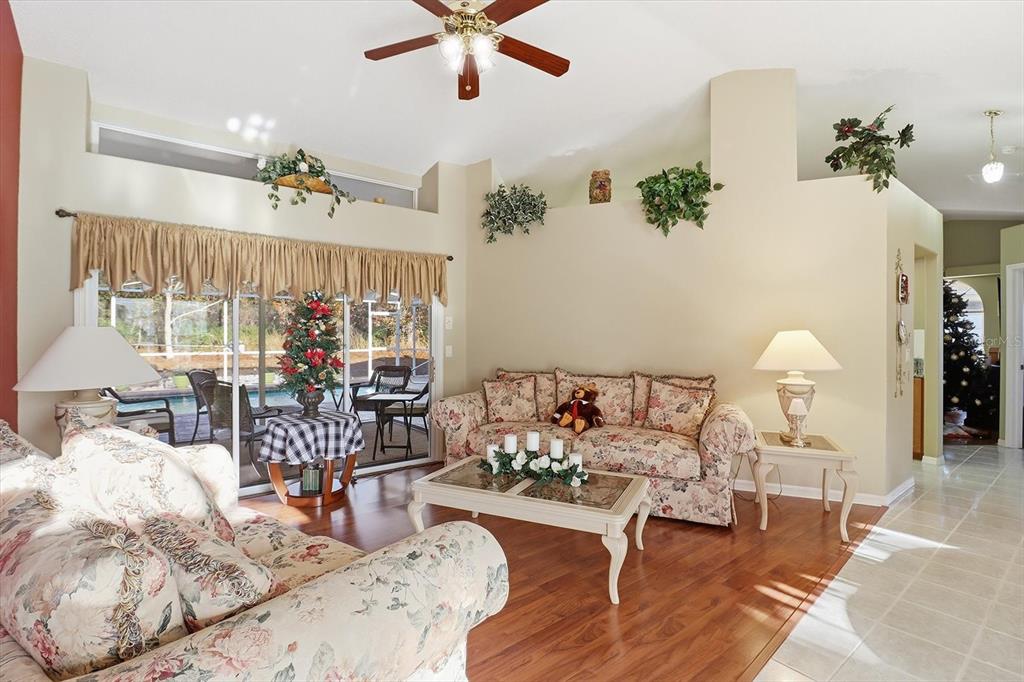 3 Ipomoea Court Homosassa, FL 34446 - Photo 9 of 46 a living room with furniture and a chandelier