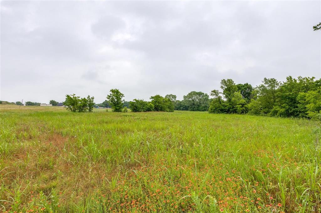 Tbd Baxter Well Road McKinney, TX 75071 - Photo 2 of 9 a view of a lake with houses in the back