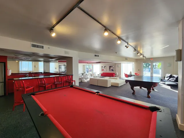 a room with lots of furniture and a large window