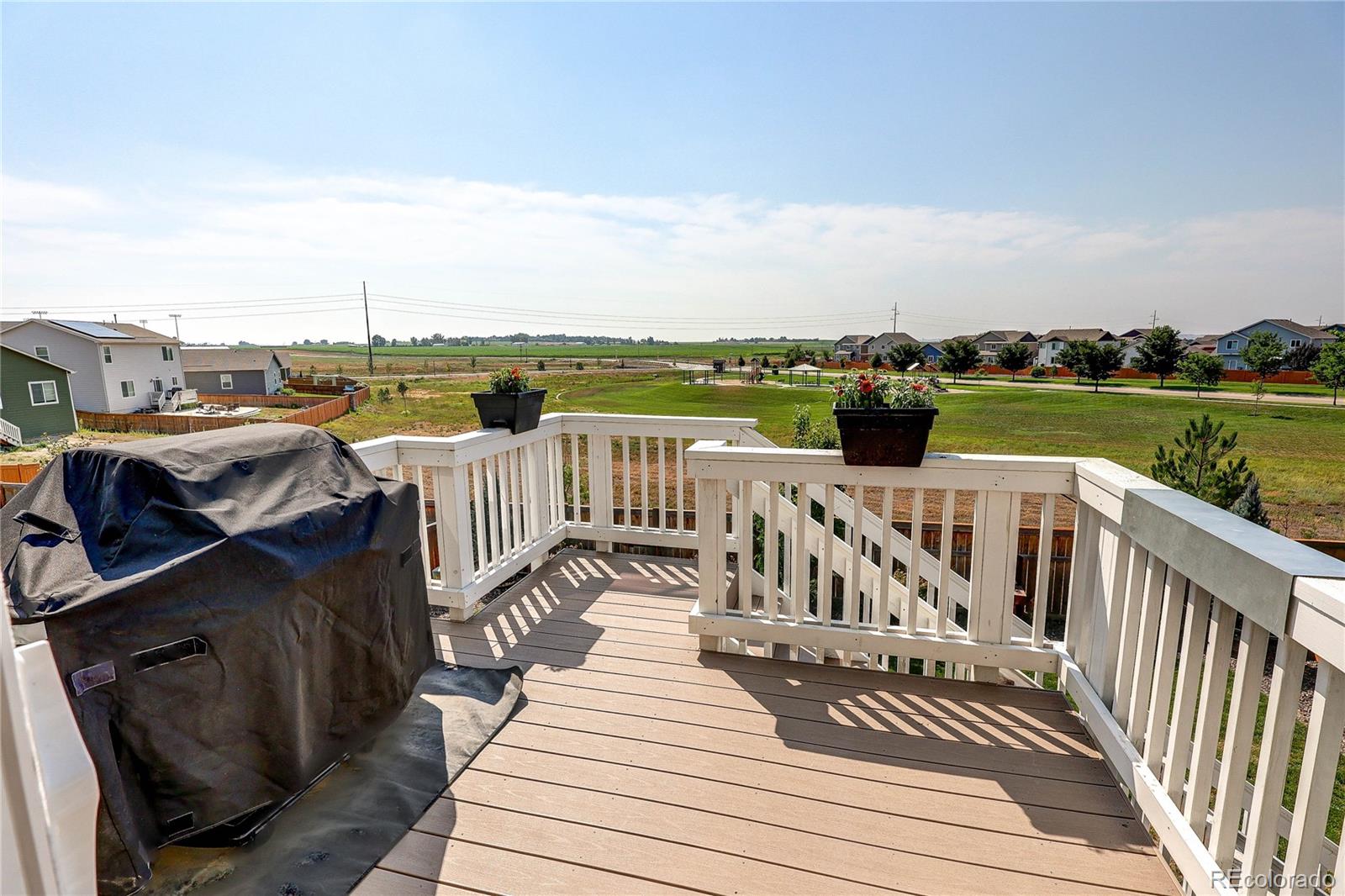 1335 Copeland Falls Road Severance, CO 80550 - Photo 16 of 48 a view of a roof deck with wooden floor and fence