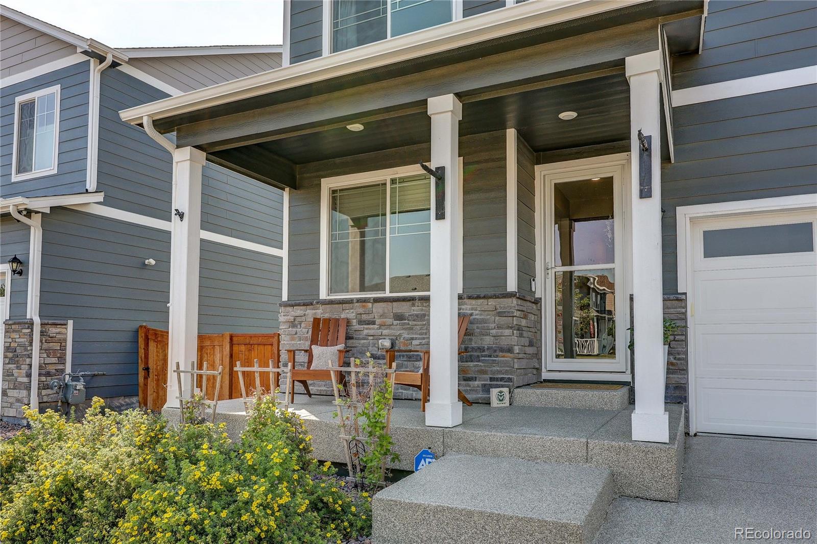 1335 Copeland Falls Road Severance, CO 80550 - Photo 2 of 48 front view of a house with a large window and door