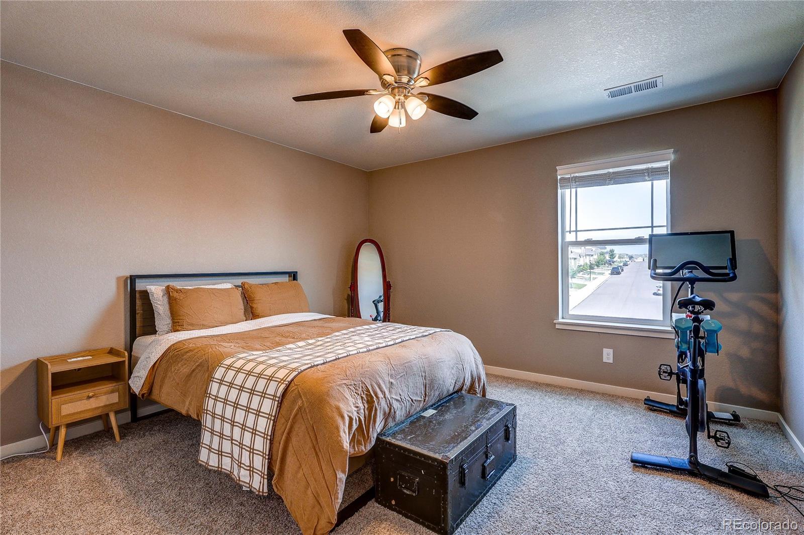 1335 Copeland Falls Road Severance, CO 80550 - Photo 30 of 48 a bedroom with a bed and a window