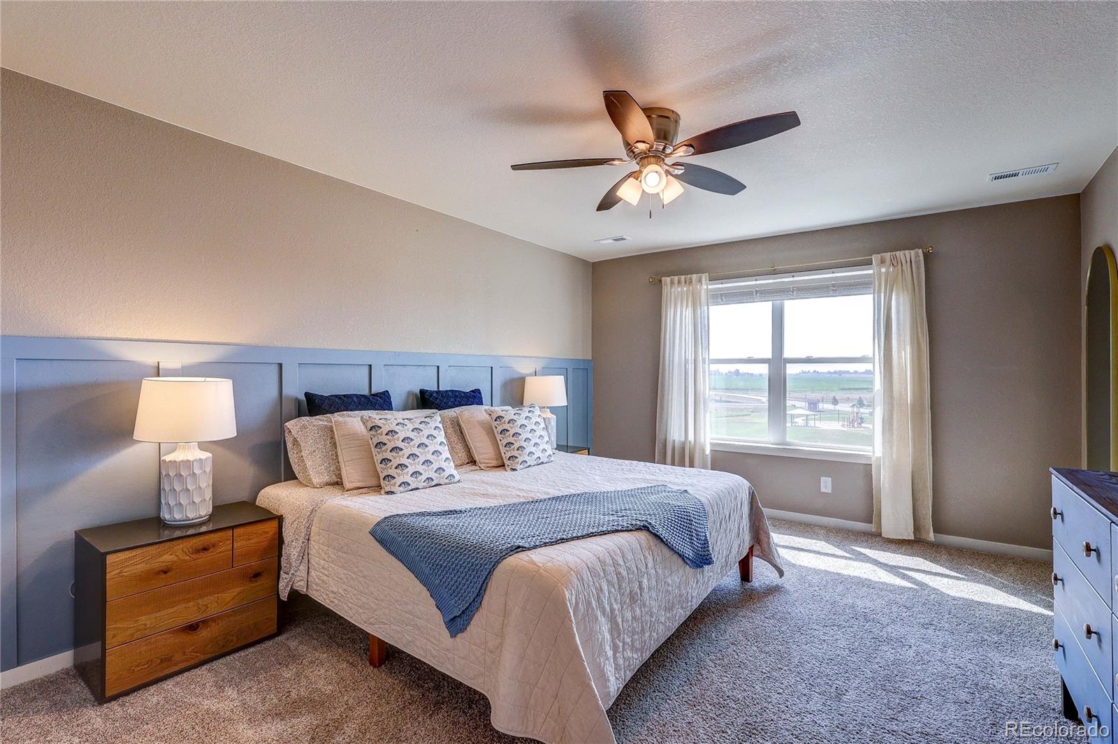 1335 Copeland Falls Road Severance, CO 80550 - Photo 32 of 48 a bedroom with a large bed and a window