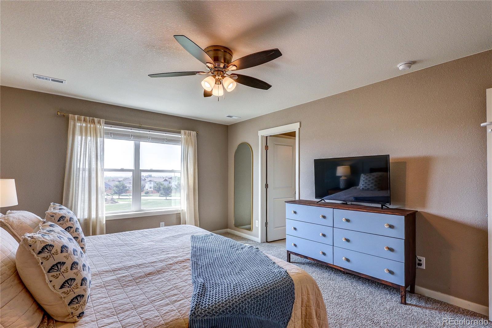 1335 Copeland Falls Road Severance, CO 80550 - Photo 33 of 48 a bedroom with a bed and a television