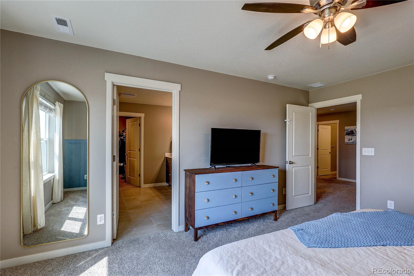 1335 Copeland Falls Road Severance, CO 80550 - Photo 34 of 48 a living room with furniture and a flat screen tv
