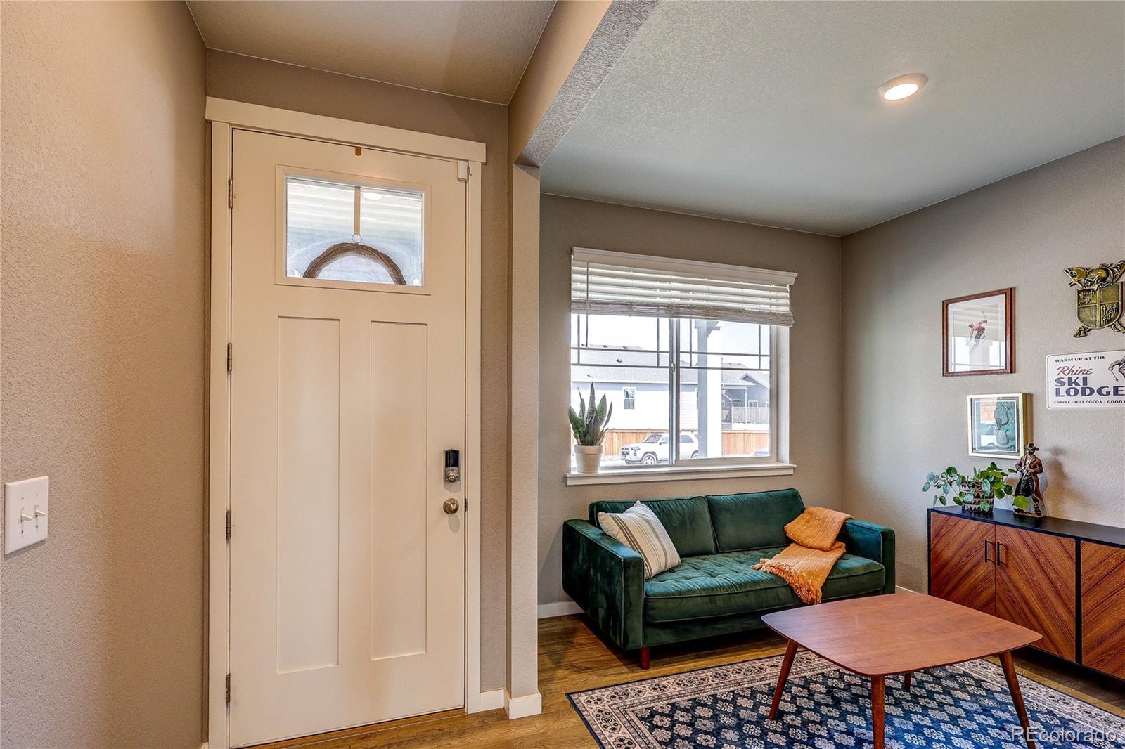 1335 Copeland Falls Road Severance, CO 80550 - Photo 4 of 48 a living room with furniture and a window