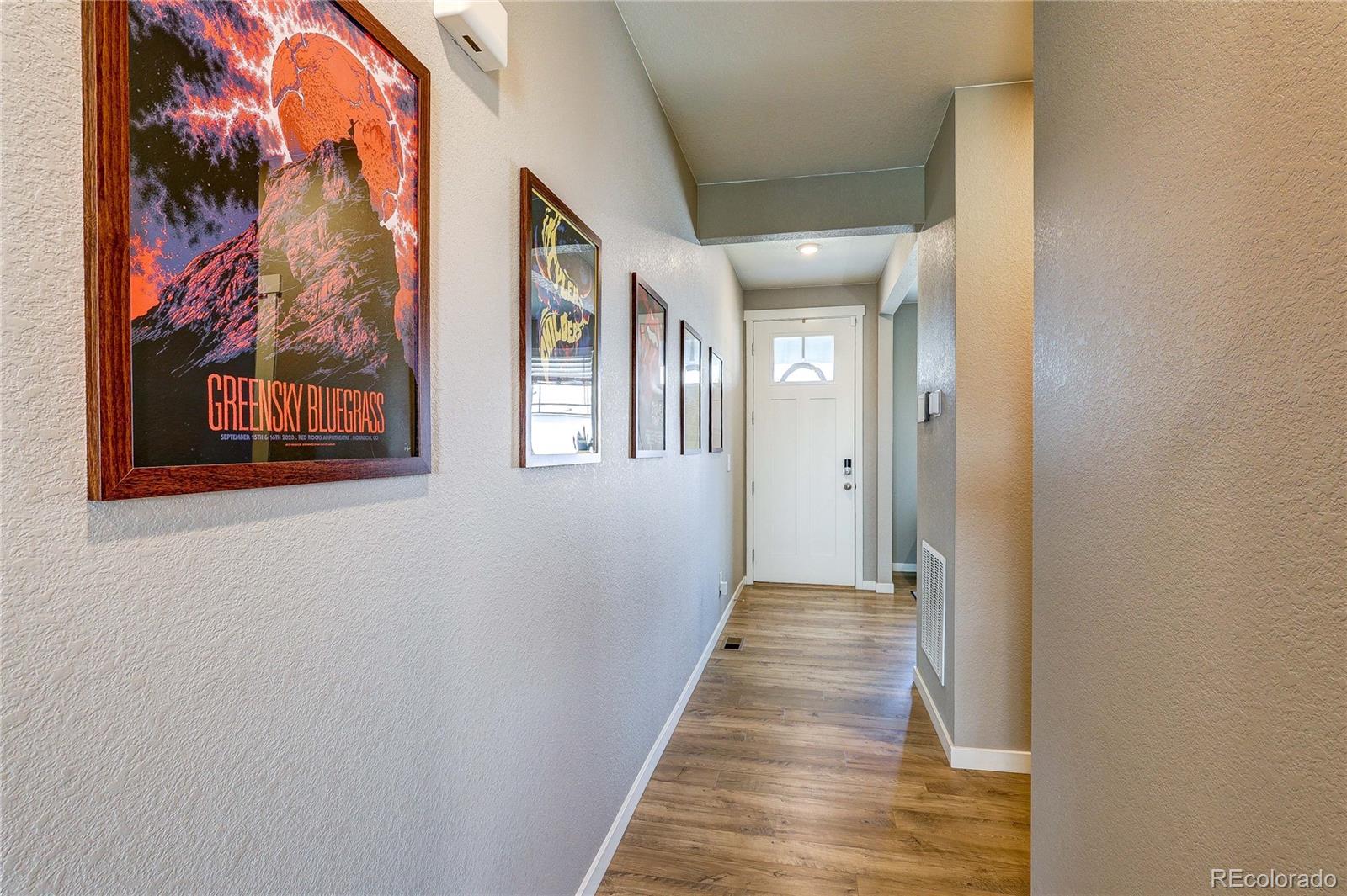 1335 Copeland Falls Road Severance, CO 80550 - Photo 8 of 48 a view of a hallway with wooden floor