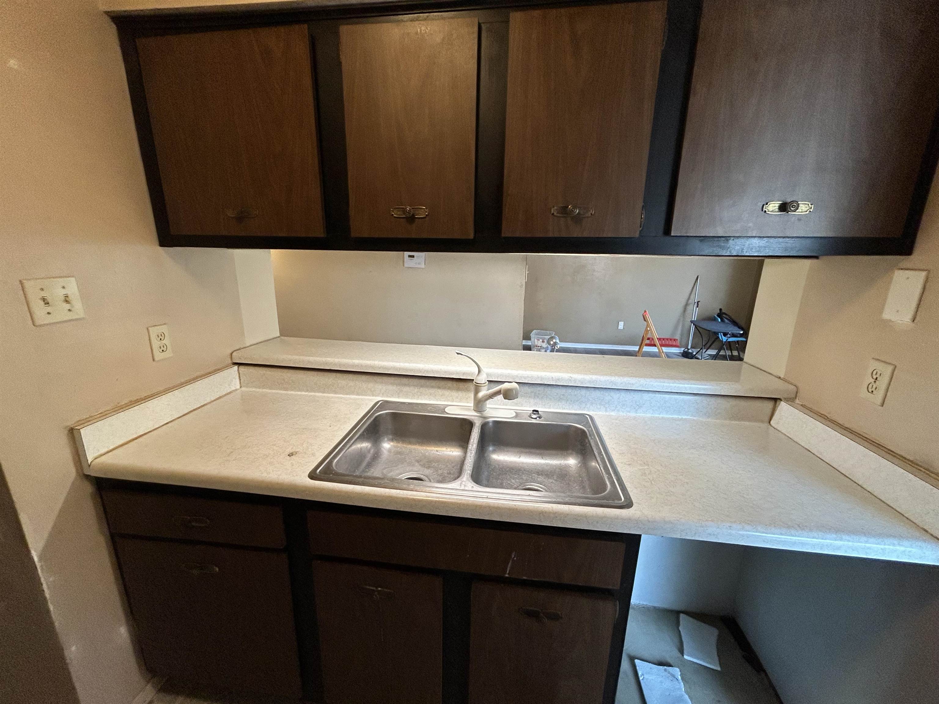 2800 Clarke Road, Unit 2 Memphis, TN 38115 - Photo 9 of 18 Kitchen area featuring a stainless steel double basin sink with a single-handle faucet