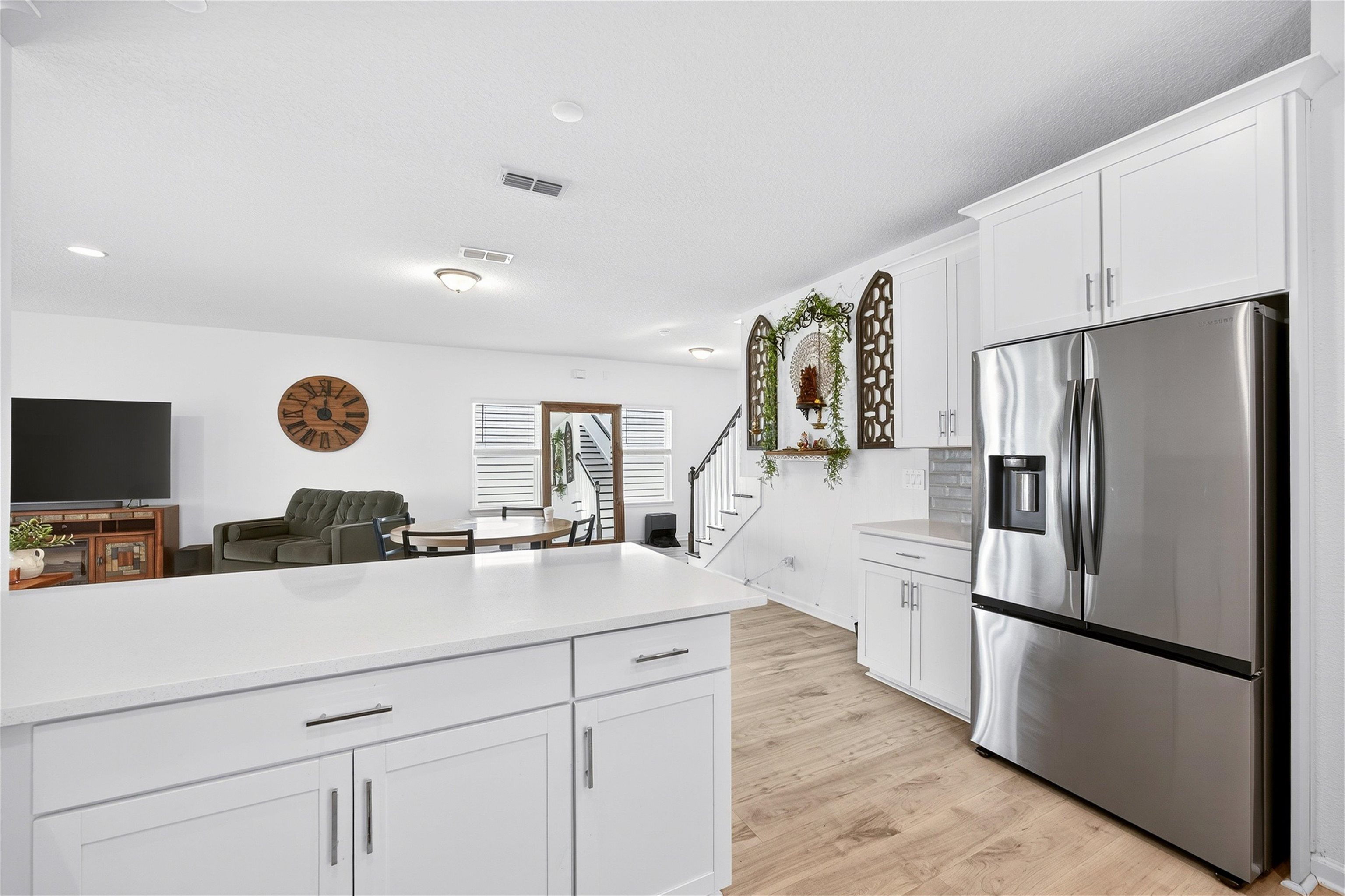 168 Torres Trace St. Augustine, FL 32095 - Photo 49 of 50 a kitchen with a refrigerator and a stove top oven