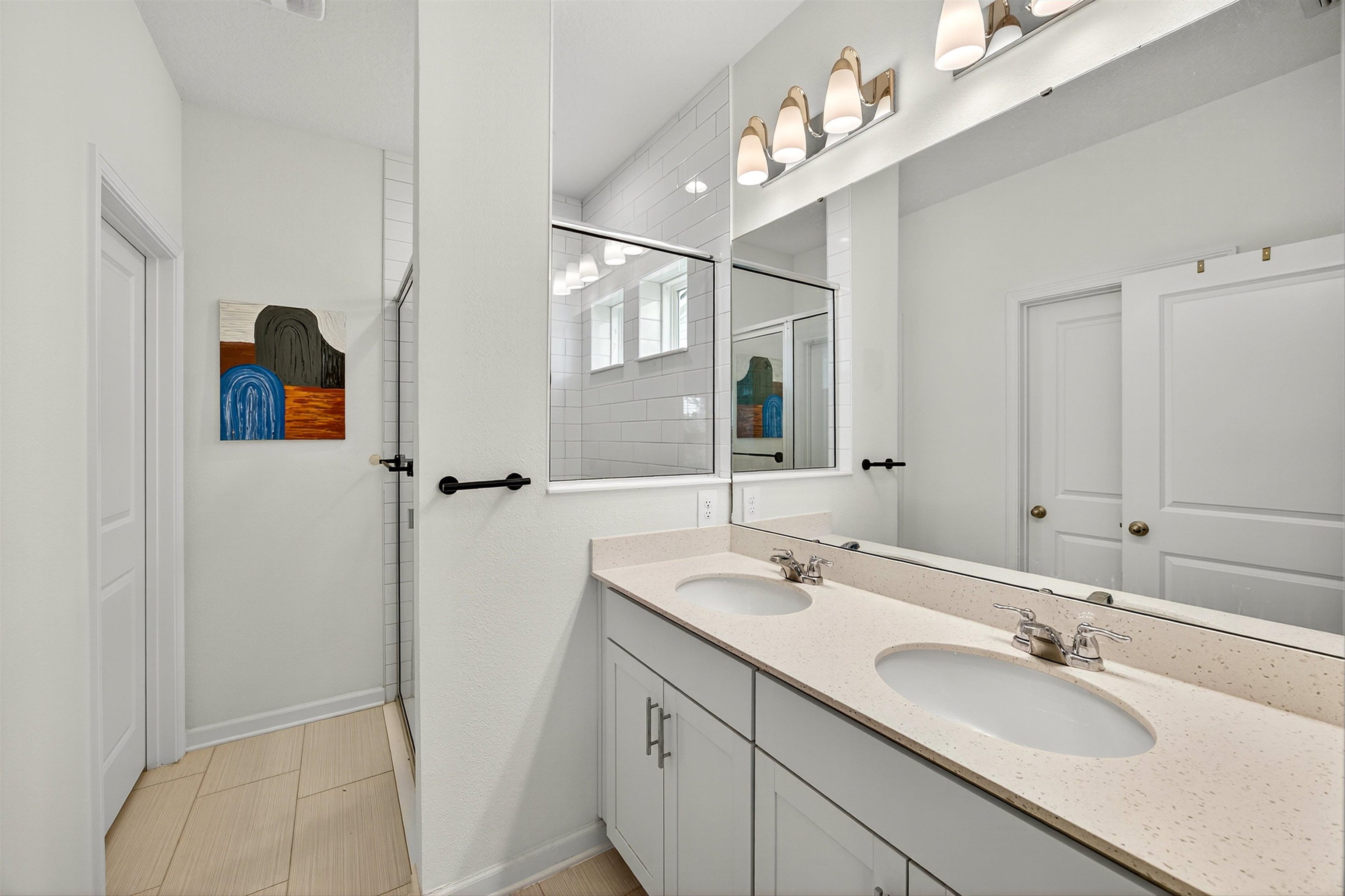 168 Torres Trace St. Augustine, FL 32095 - Photo 17 of 50 a bathroom with a double vanity sink mirror and vanity