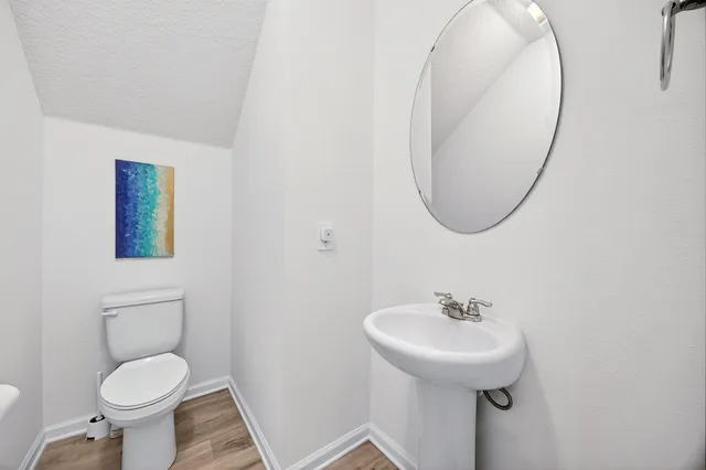 a bathroom with a double vanity sink mirror and vanity