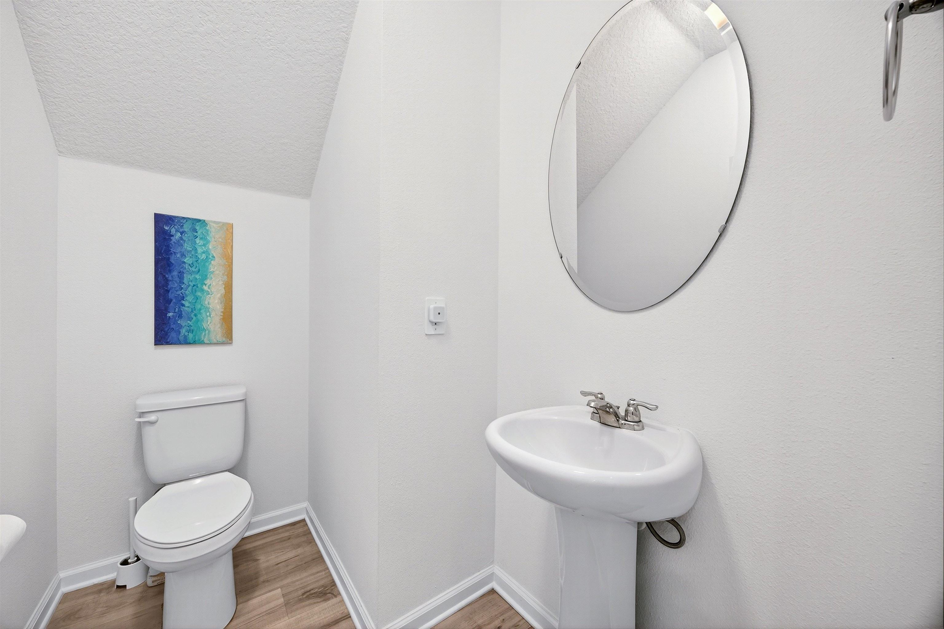 168 Torres Trace St. Augustine, FL 32095 - Photo 18 of 50 a bathroom with a toilet sink and mirror