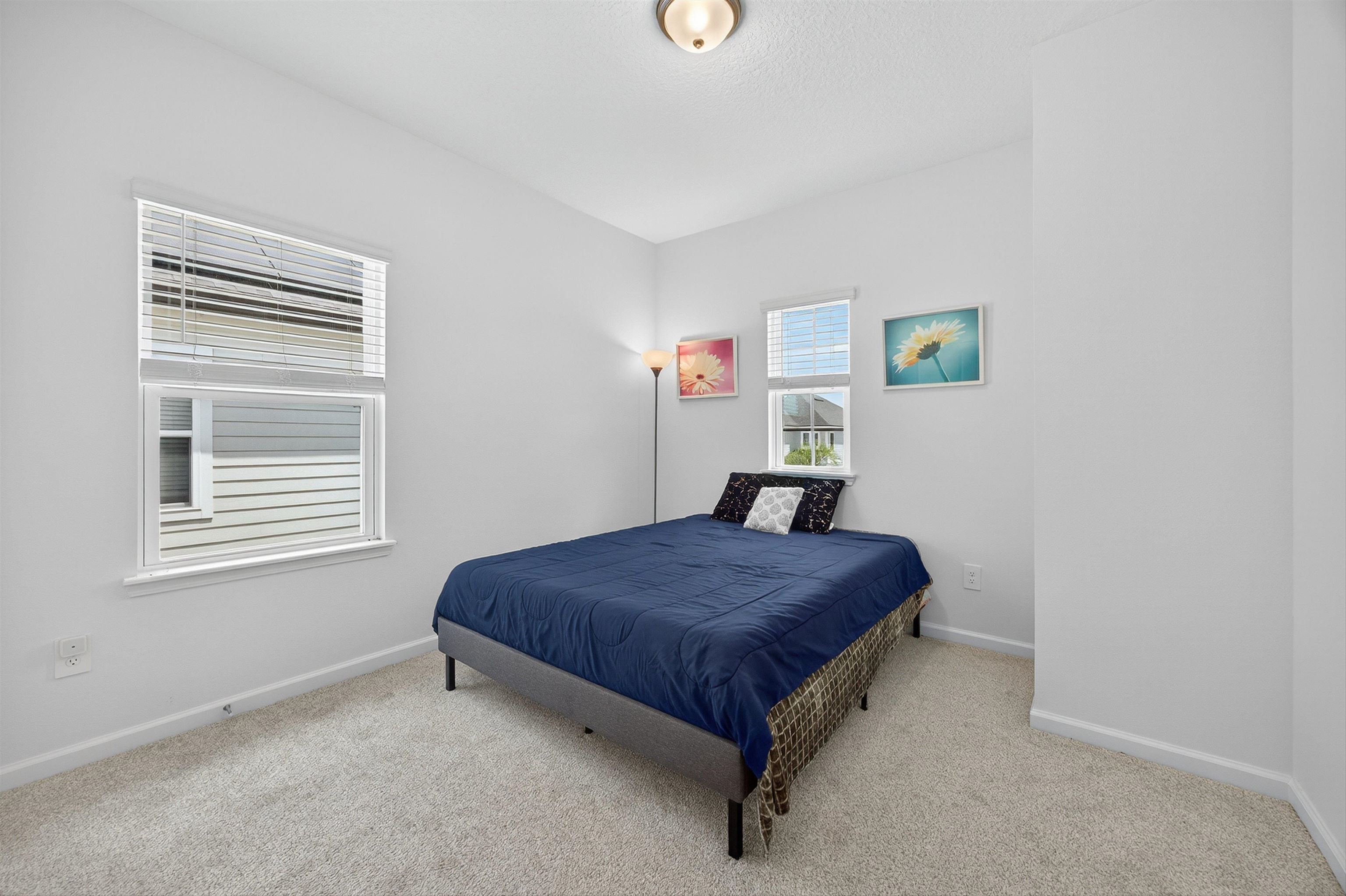 168 Torres Trace St. Augustine, FL 32095 - Photo 22 of 50 a bedroom with a bed and a window