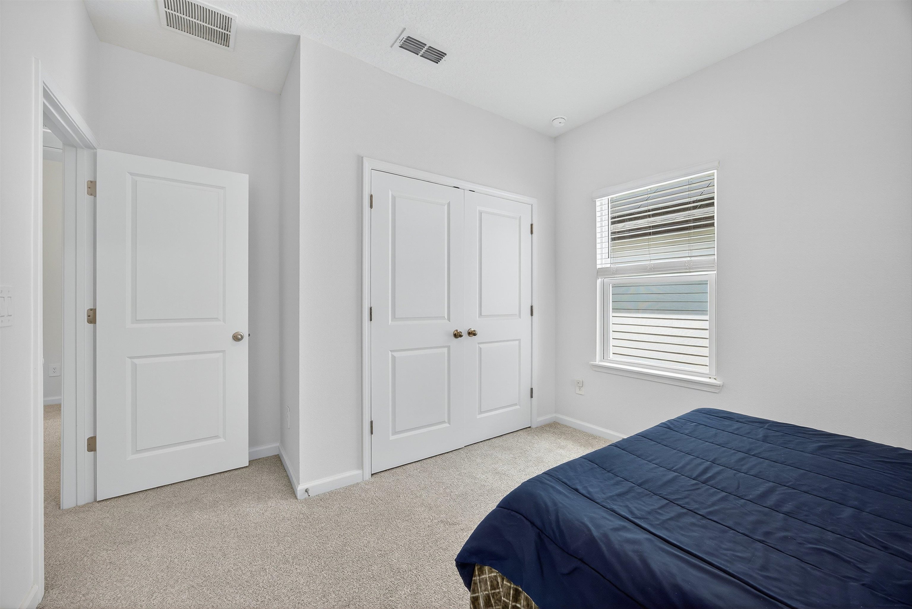 168 Torres Trace St. Augustine, FL 32095 - Photo 23 of 50 a bedroom with a bed and a window