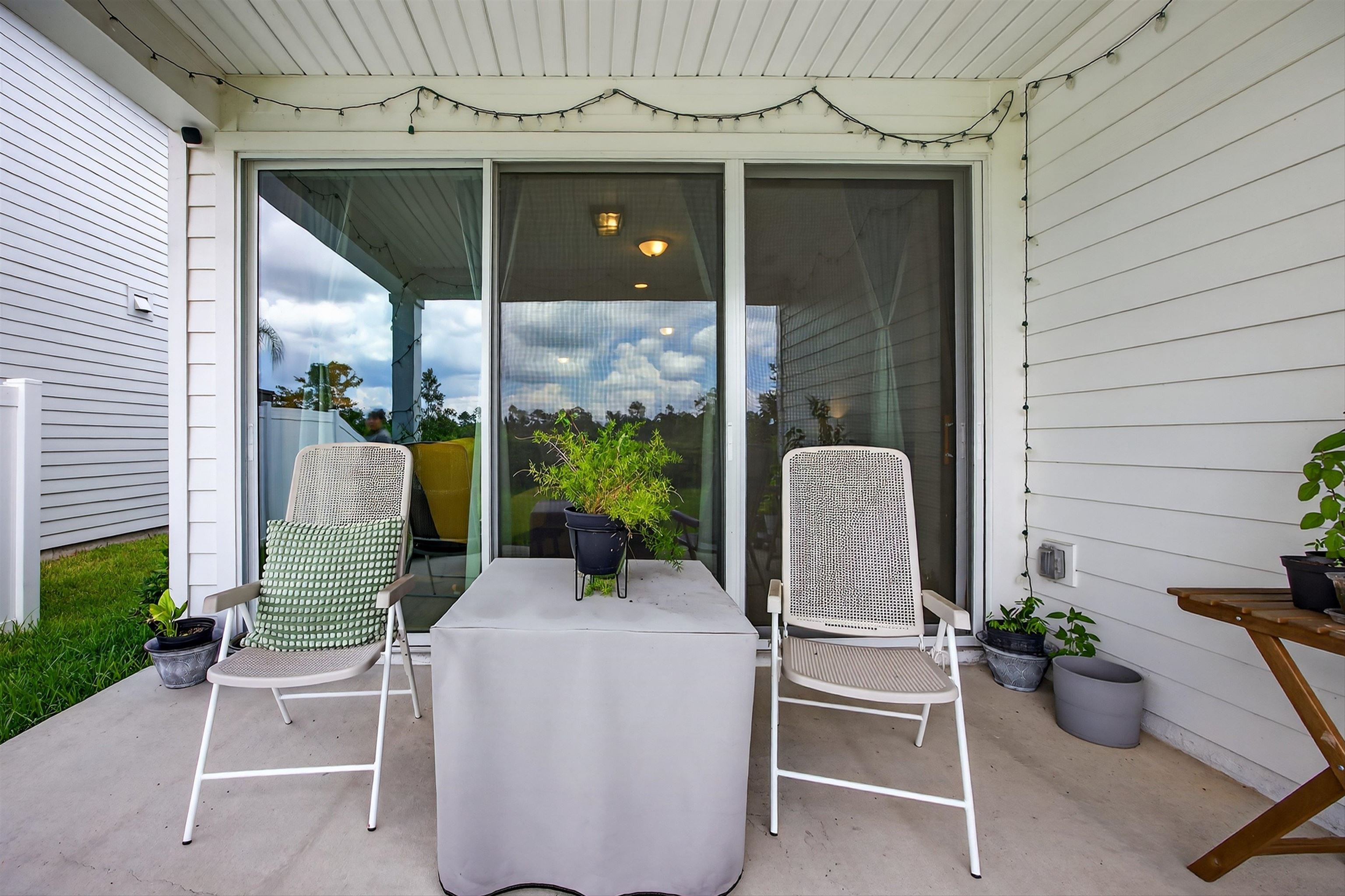 168 Torres Trace St. Augustine, FL 32095 - Photo 31 of 50 a two chairs sitting in front of a house