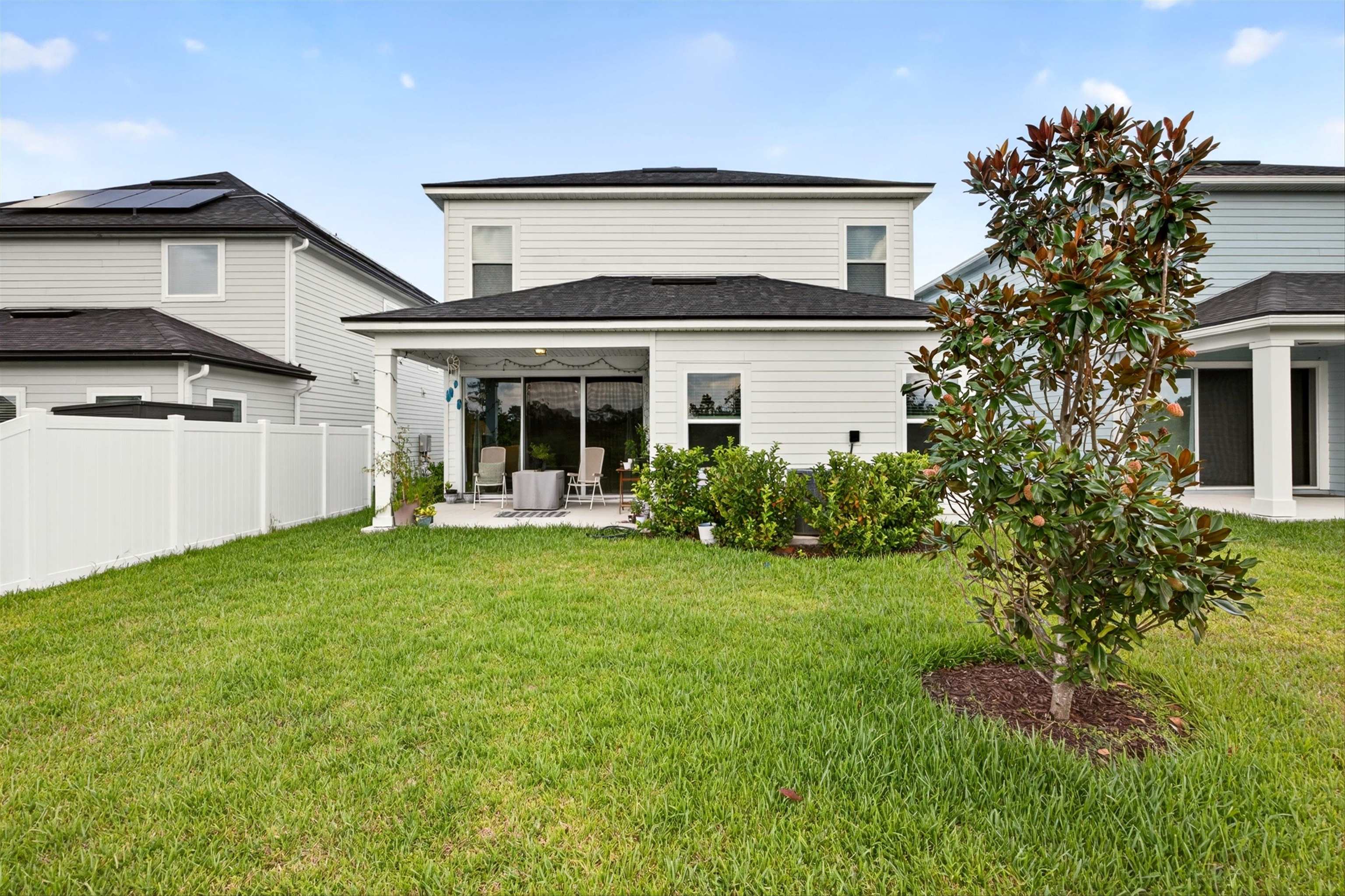 168 Torres Trace St. Augustine, FL 32095 - Photo 34 of 50 a view of a house with a backyard