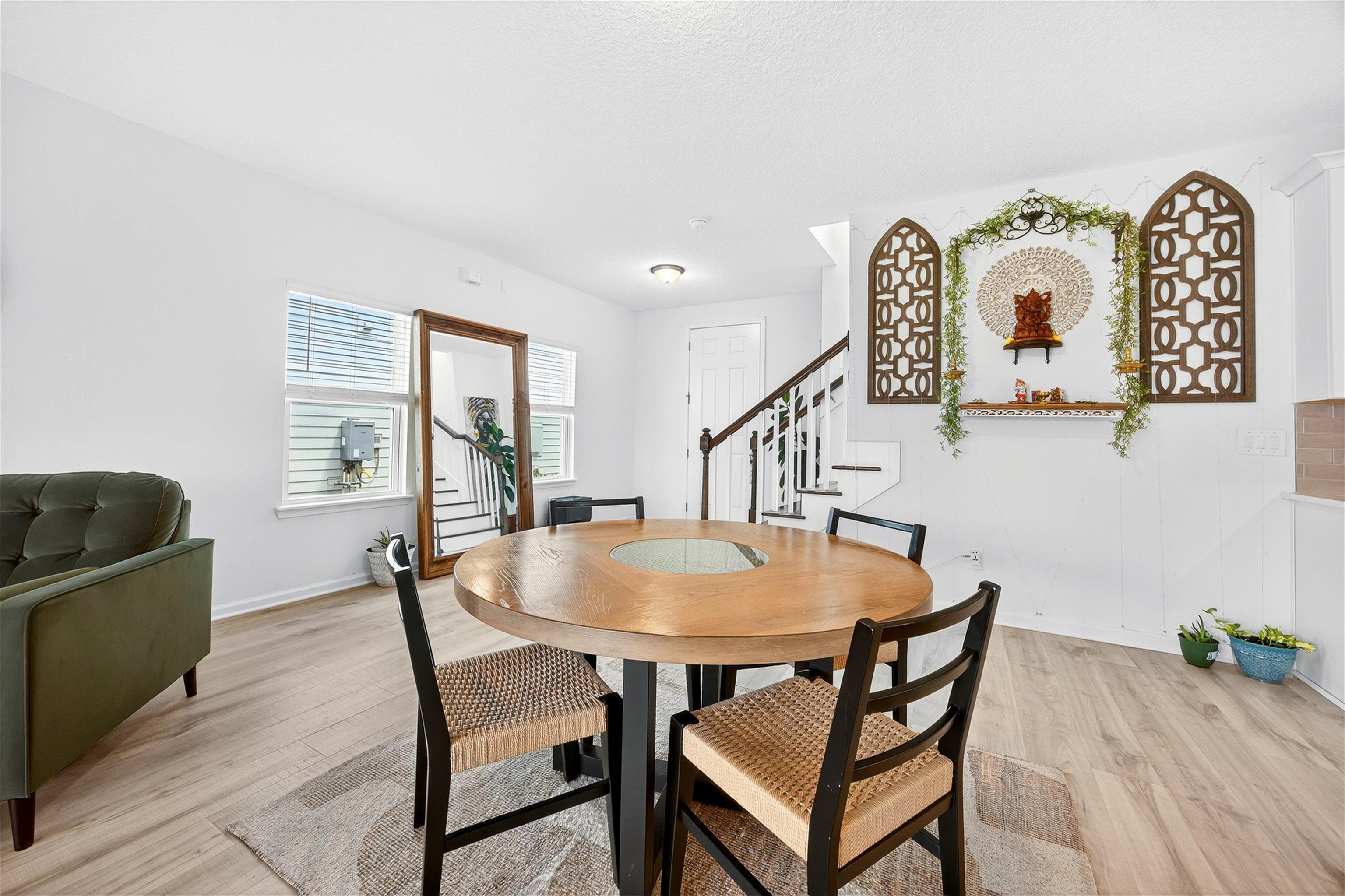168 Torres Trace St. Augustine, FL 32095 - Photo 10 of 50 a view of a dining room with furniture and wooden floor