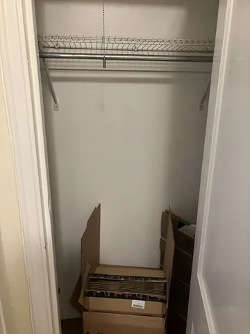 a view of a hallway with a chair