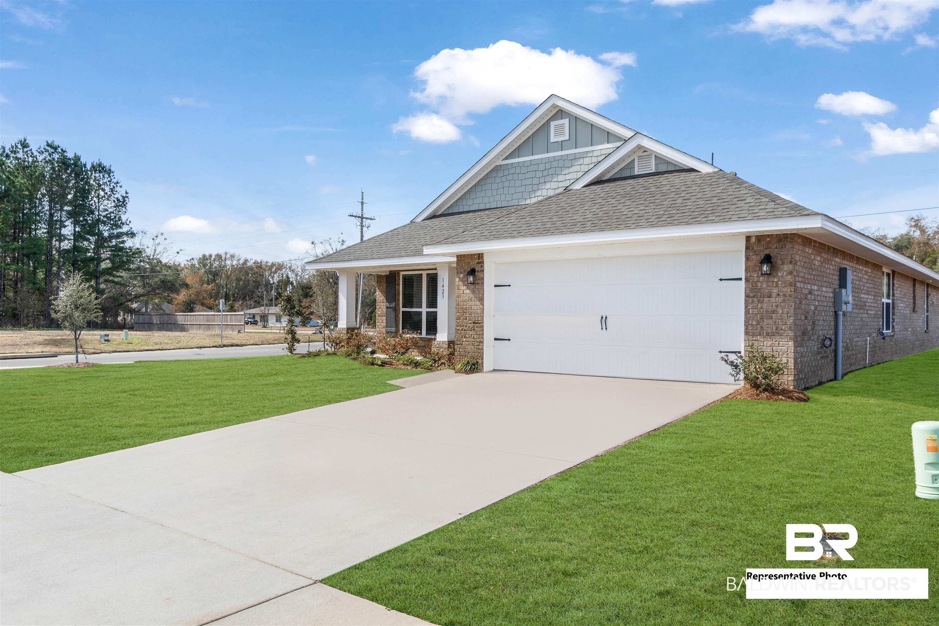 660 Mayflower Drive Foley, AL 36535 - Photo 35 of 36 Craftsman-style house with a garage and a front lawn