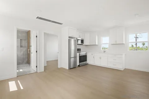 a view of an empty room with a window