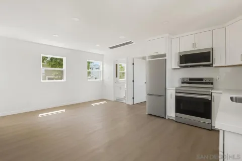 a view of a livingroom with a kitchen