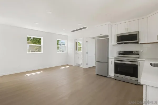 a view of a livingroom with a kitchen