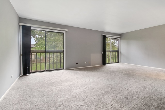800 Oregon Trail Roselle, IL 60172 - Photo 6 of 16 a view of an empty room with a window
