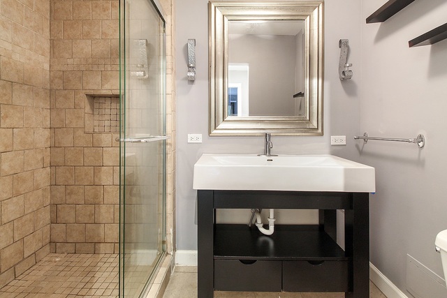 800 Oregon Trail Roselle, IL 60172 - Photo 7 of 16 a bathroom with a sink and a mirror