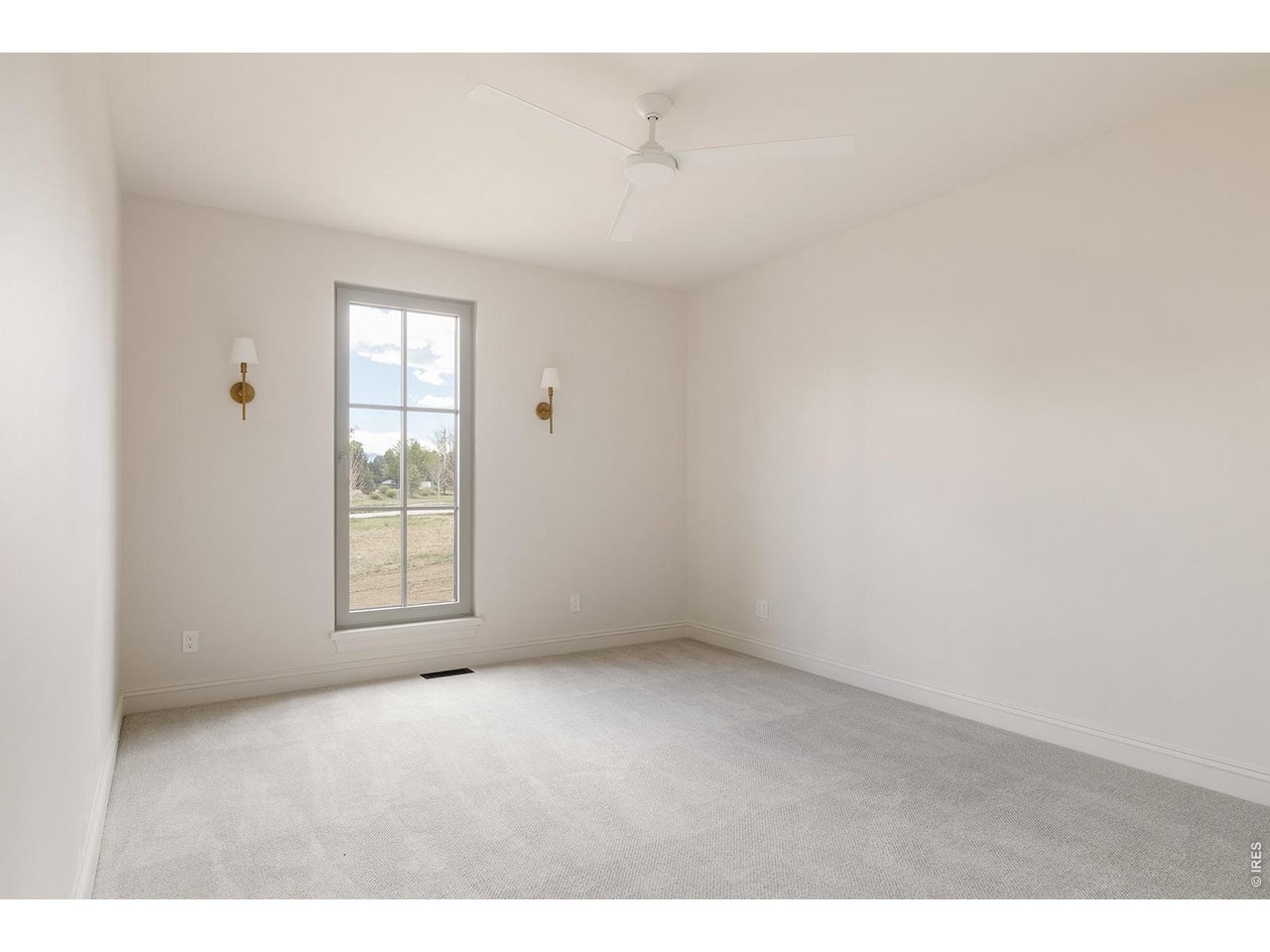 918 Cub Court Fort Collins, CO 80525 - Photo 24 of 45 a view of an empty room with a window
