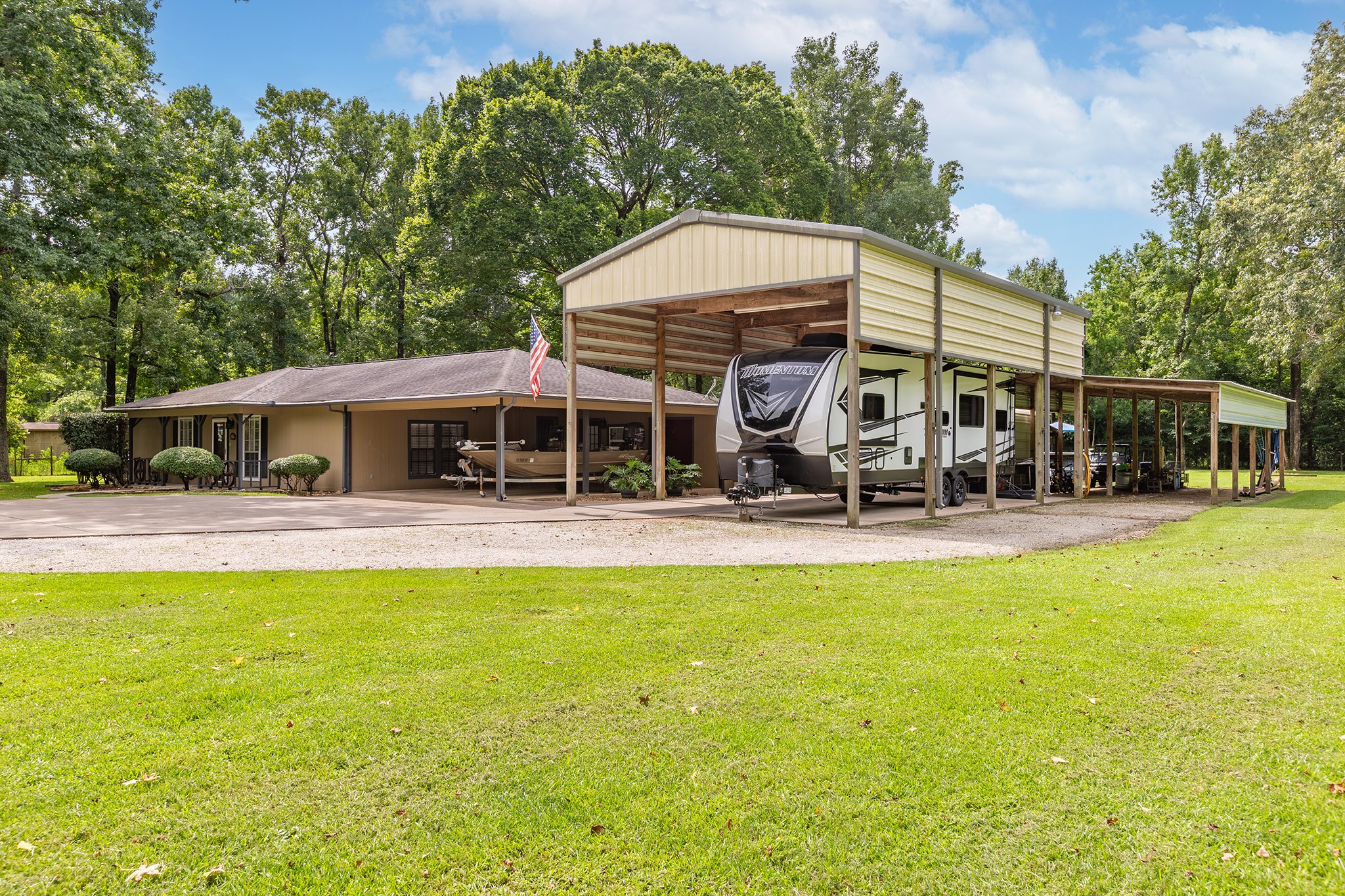 a view of a house with swimming pool and sitting area