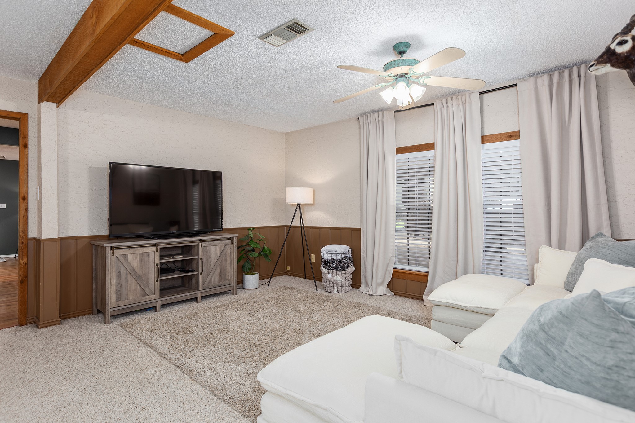 175 County Road 2005 Liberty, TX 77575 - Photo 11 of 42 a living room with furniture and a flat screen tv