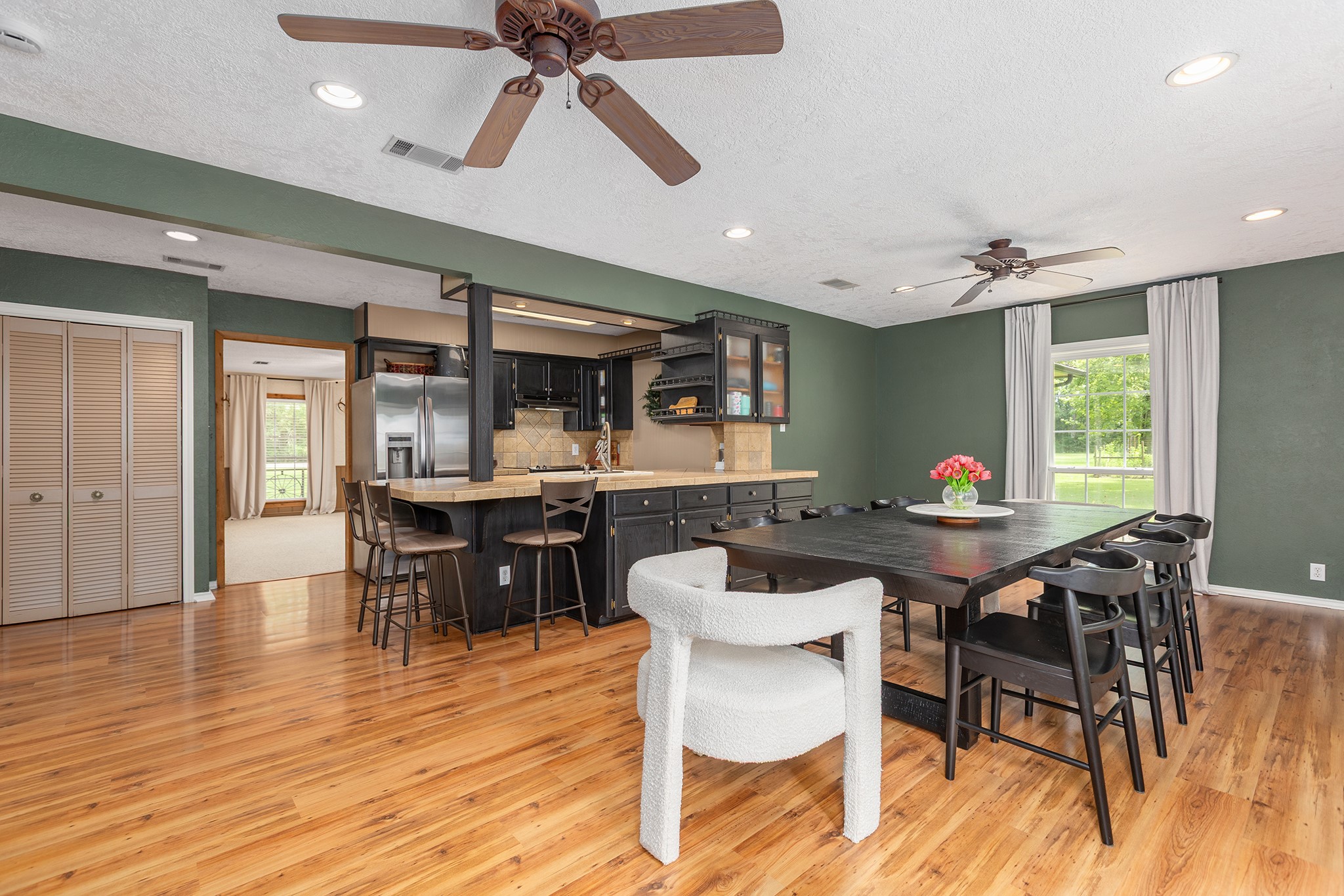 175 County Road 2005 Liberty, TX 77575 - Photo 16 of 42 a view of a dining room with furniture and wooden floor