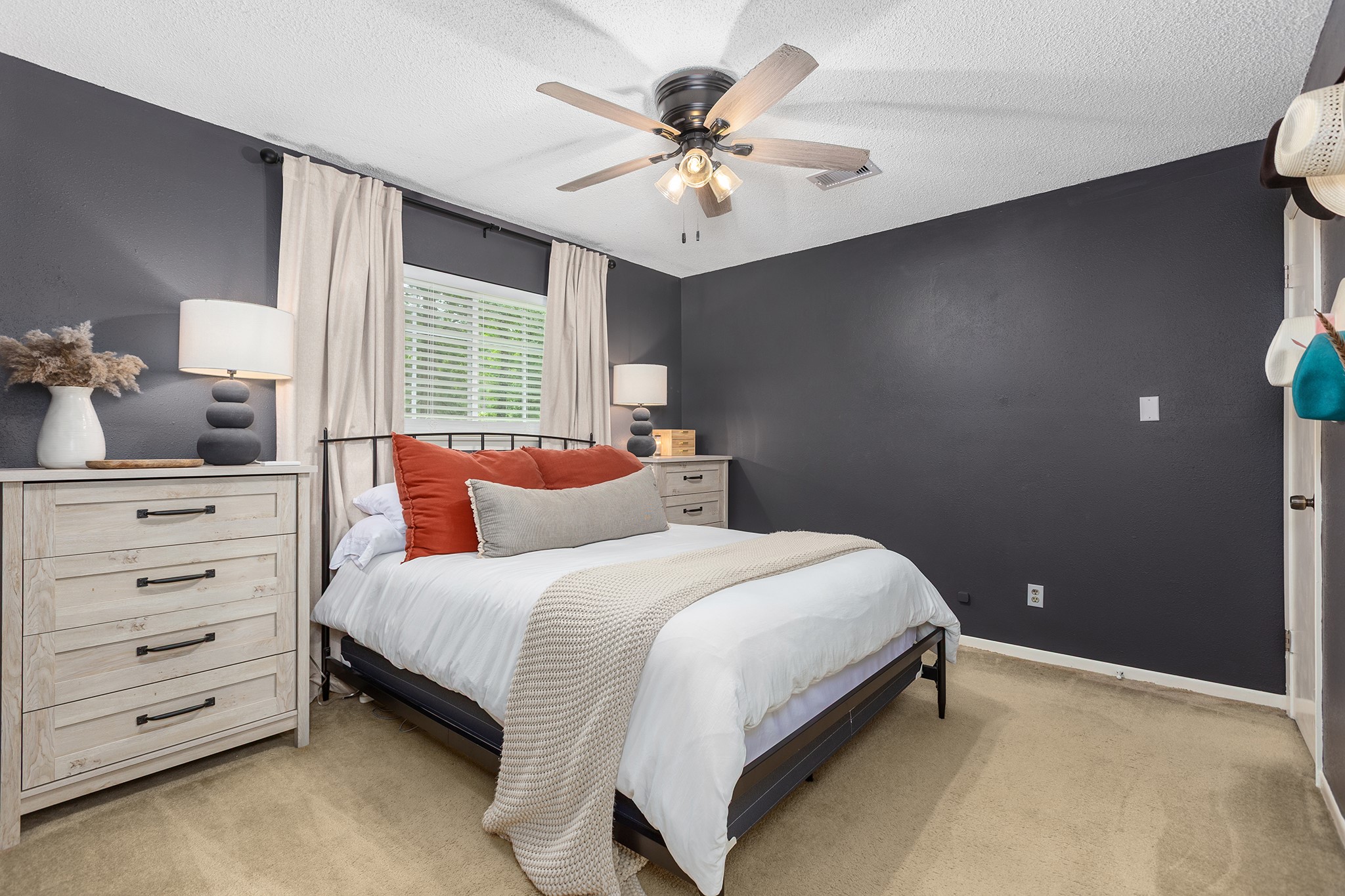 175 County Road 2005 Liberty, TX 77575 - Photo 25 of 42 a bedroom with a bed a dresser and a chandelier