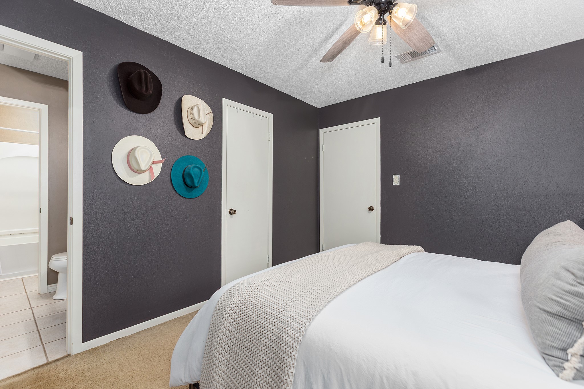 175 County Road 2005 Liberty, TX 77575 - Photo 26 of 42 a bedroom with a bed and a chandelier