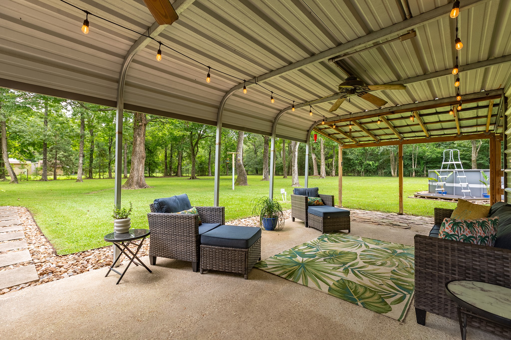 175 County Road 2005 Liberty, TX 77575 - Photo 31 of 42 a view of a patio with a table chairs and a backyard