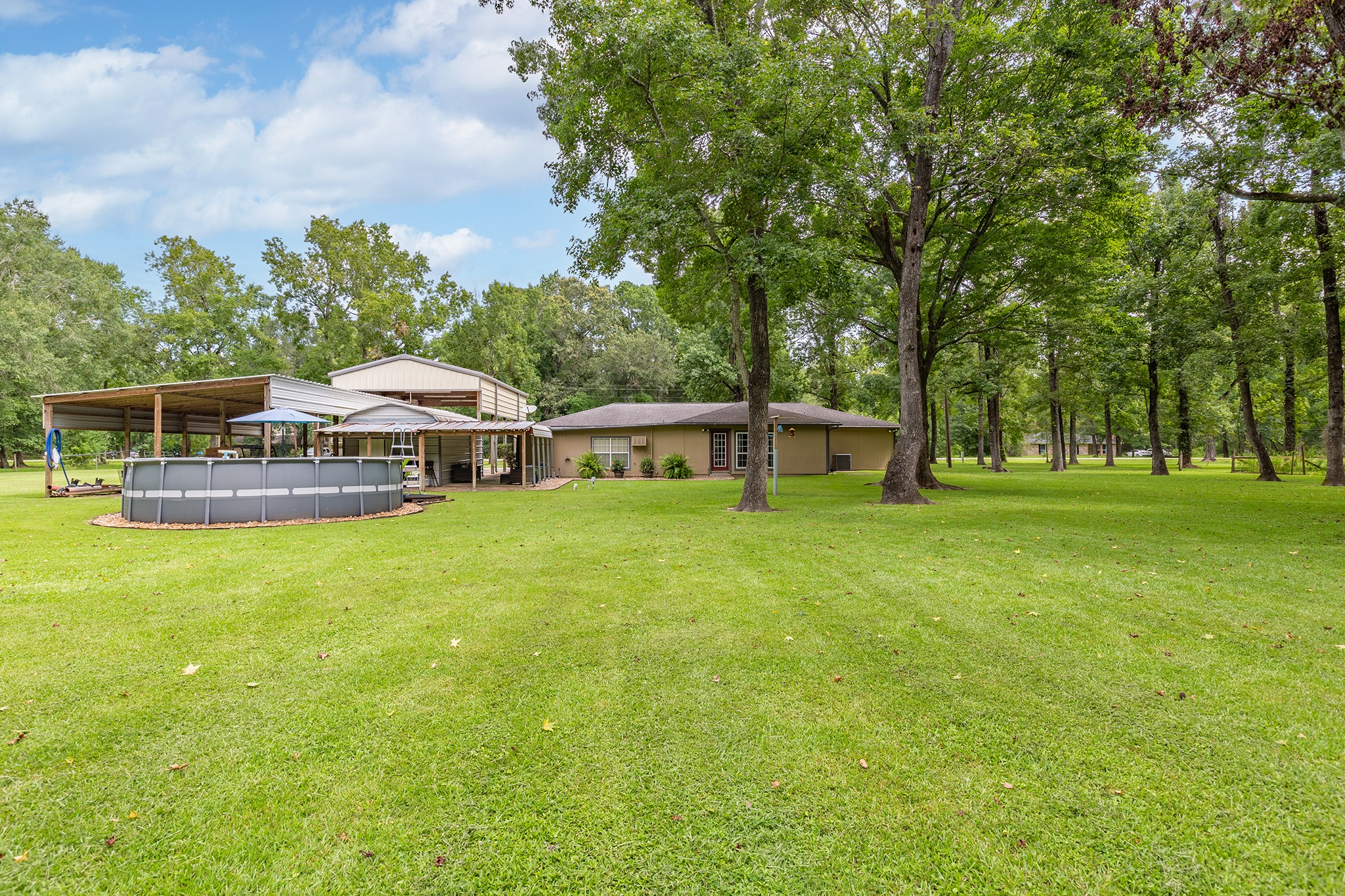 175 County Road 2005 Liberty, TX 77575 - Photo 35 of 42 a view of a house with a big yard