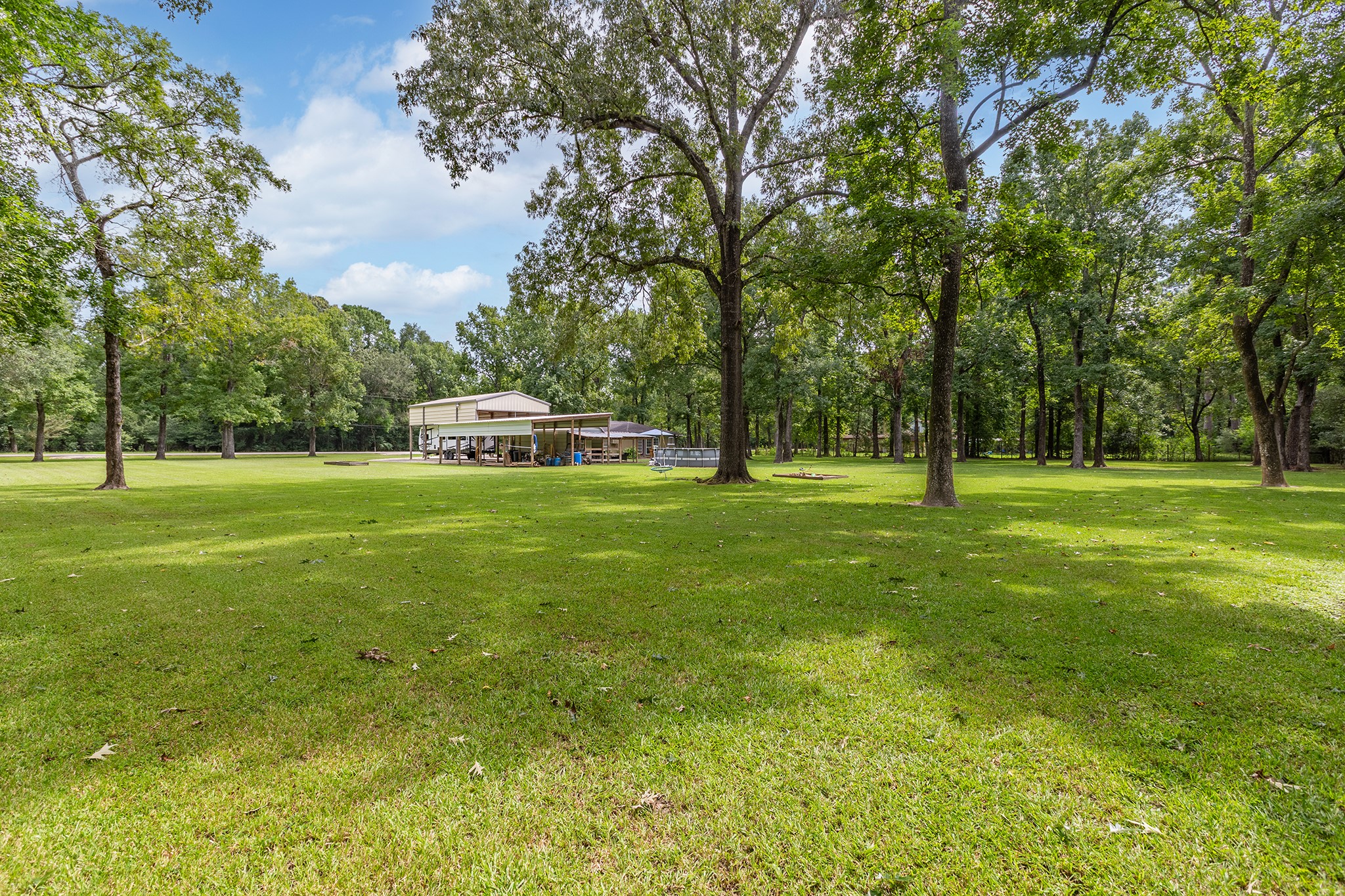 175 County Road 2005 Liberty, TX 77575 - Photo 40 of 42 a front view of a house with a yard