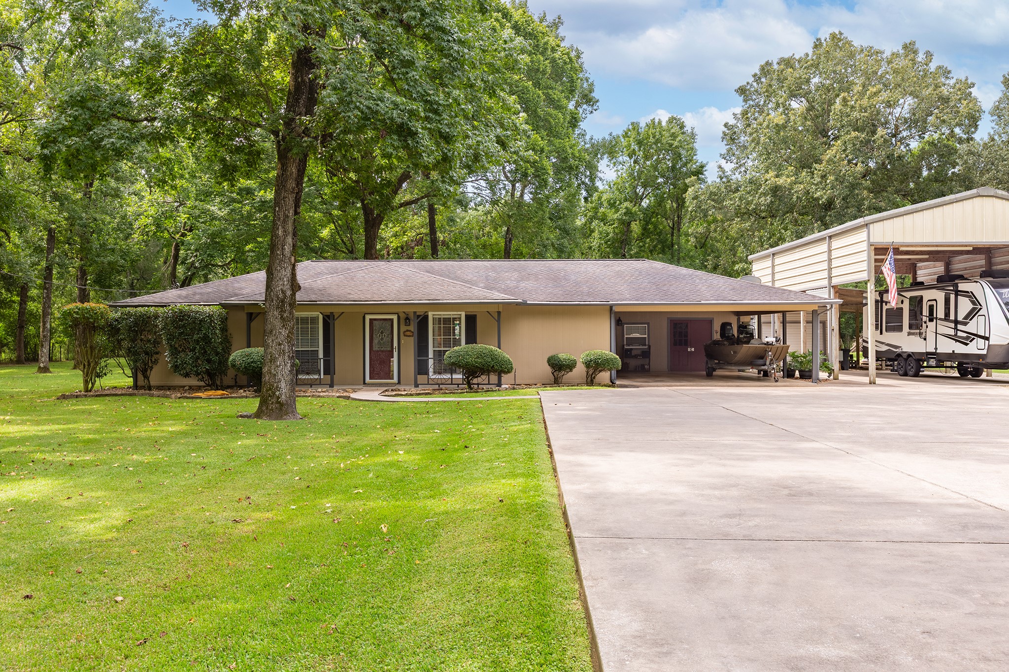 175 County Road 2005 Liberty, TX 77575 - Photo 41 of 42 a front view of a house with a garden
