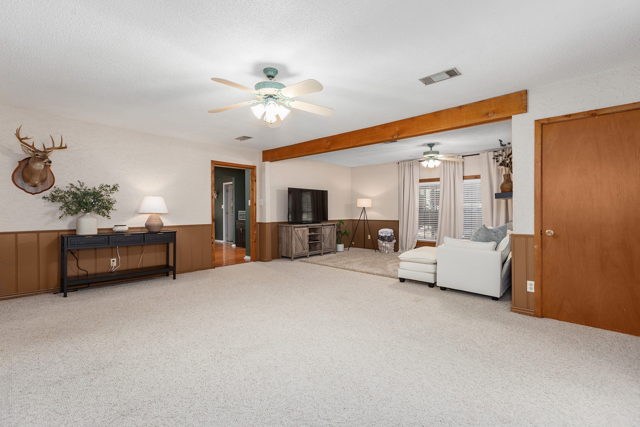 175 County Road 2005 Liberty, TX 77575 - Photo 8 of 42 a living room with furniture and a chandelier