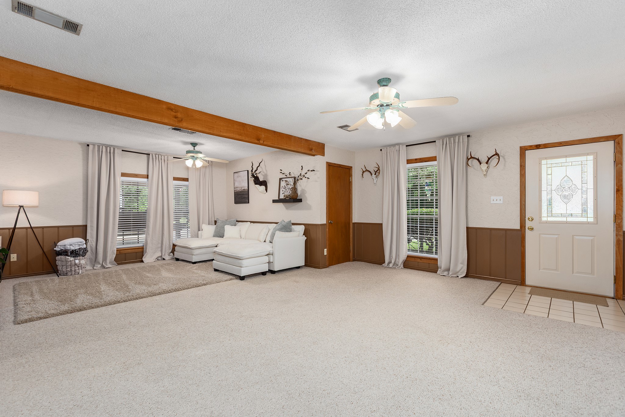 175 County Road 2005 Liberty, TX 77575 - Photo 9 of 42 a living room with furniture and a chandelier