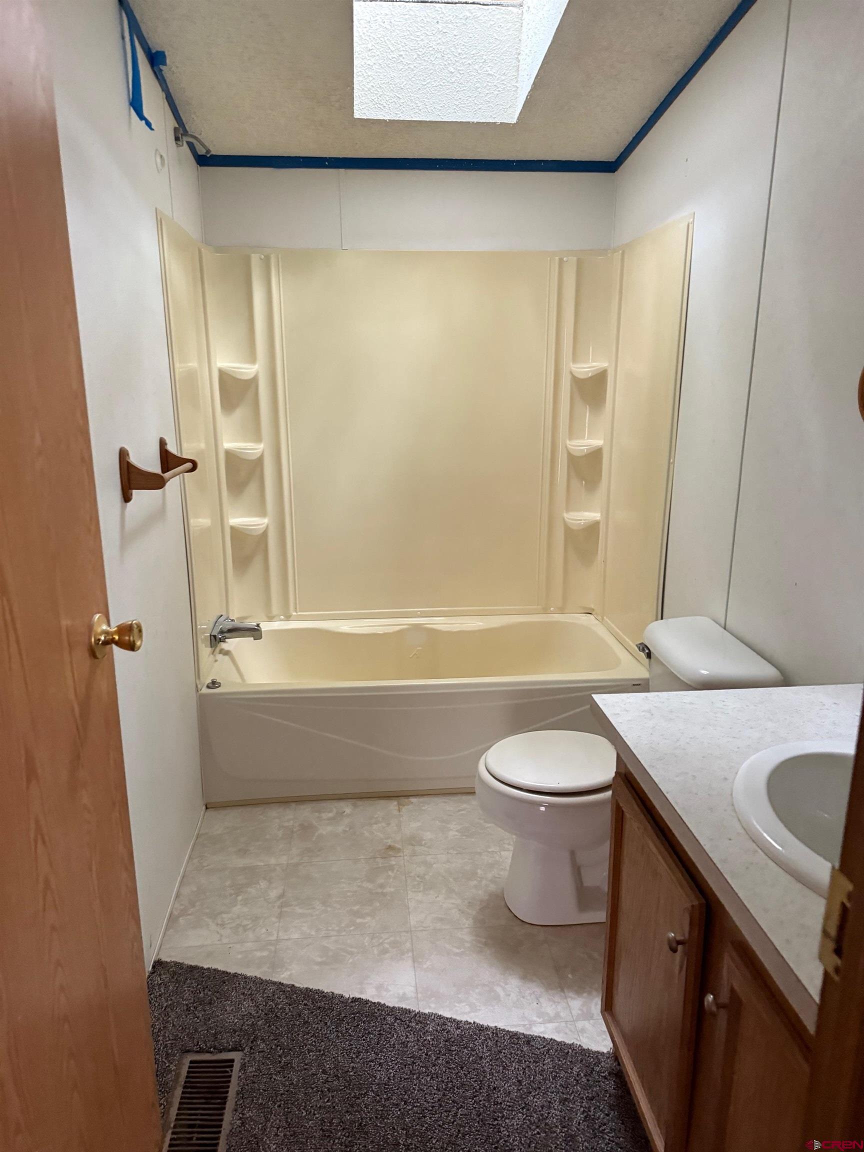 440 Park Drive Naturita, CO 81422 - Photo 16 of 18 a bathroom with a sink a toilet and shower