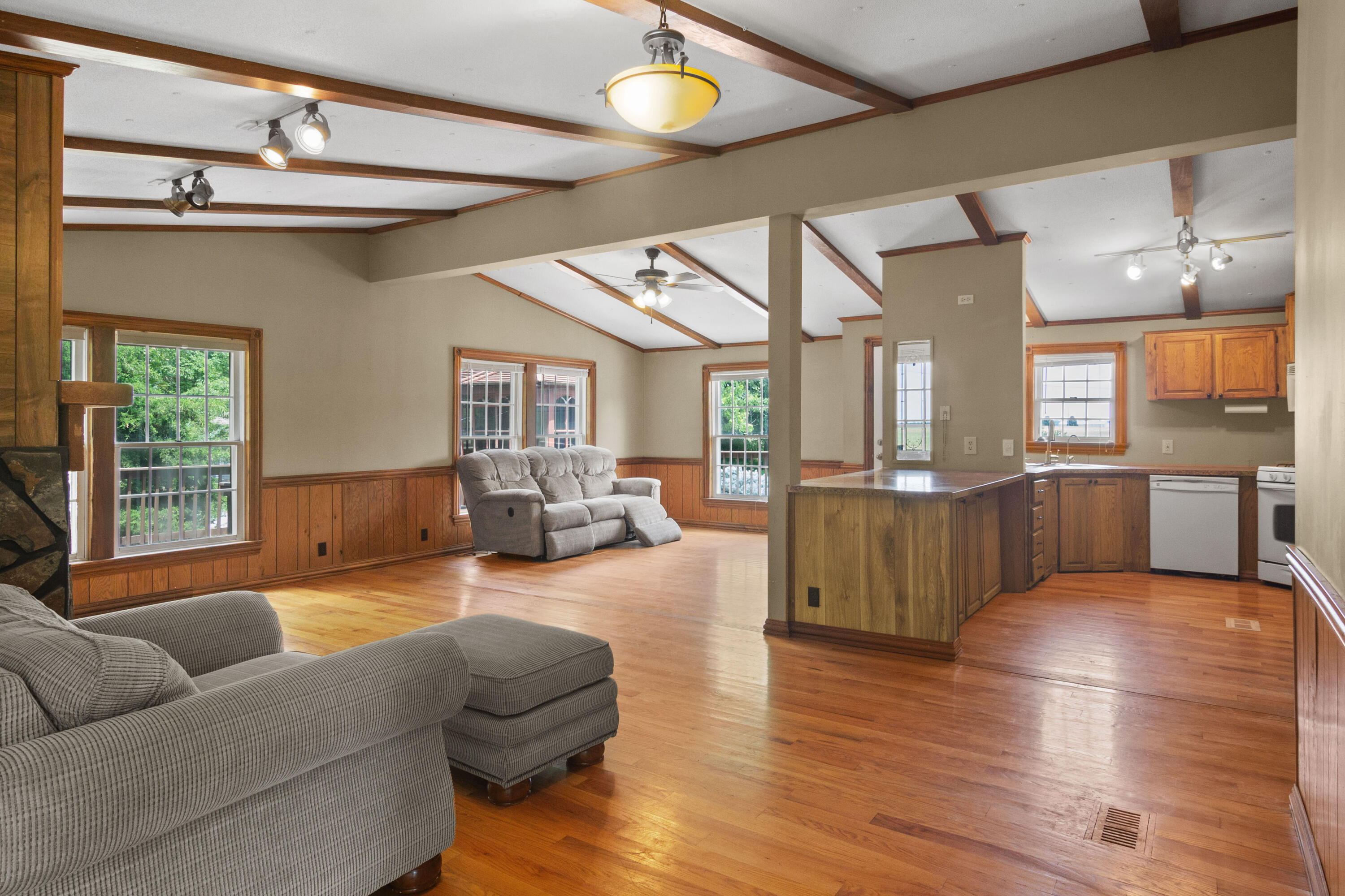 23102 Pierce Street Lowell, IN 46356 - Photo 11 of 32 a living room with furniture wooden floor and a large window